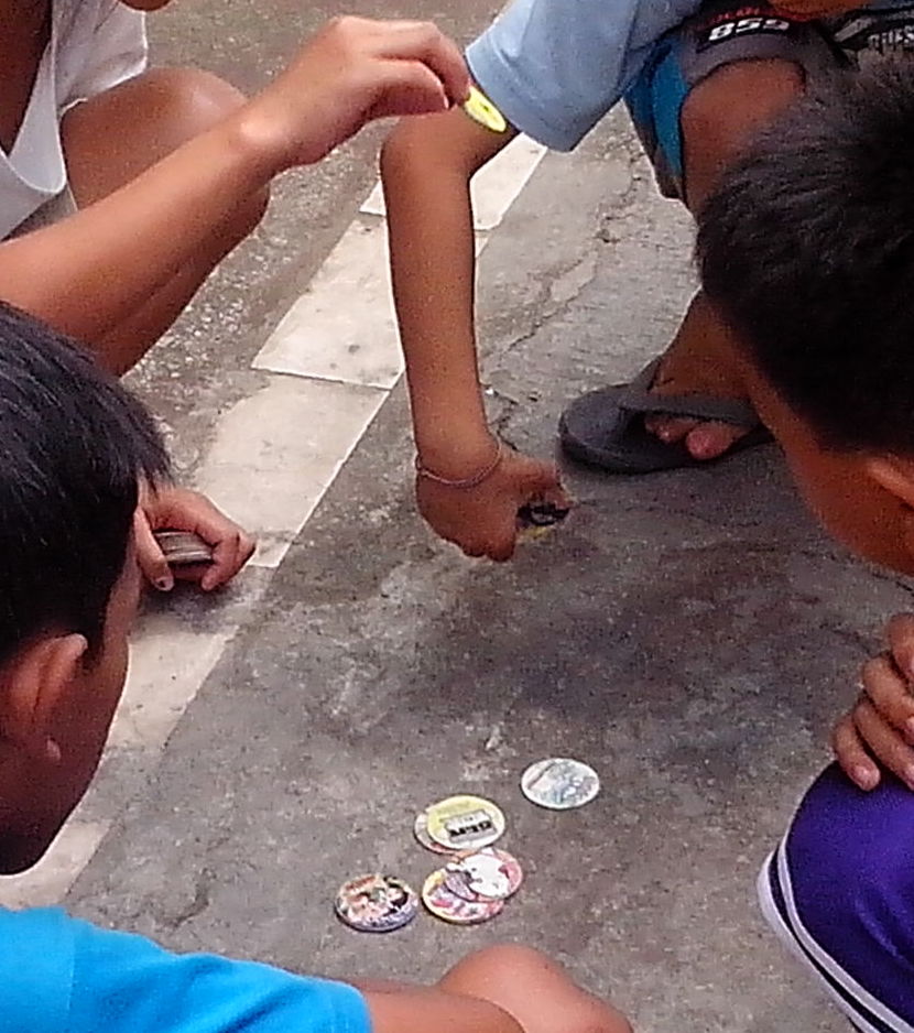 File:Kids playing pogs.jpeg