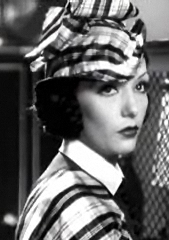 Black and white film still of Lupe Vélez wearing tartan from the 1934 film Laughing Boy