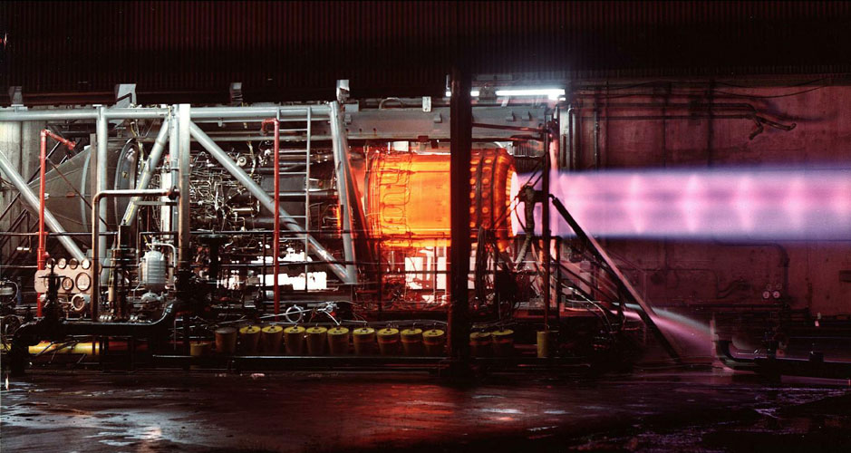 This picture of an uninstalled engine being tested illustrates the need for cooling air around the exhaust duct. The engine, when installed as part of the powerplant, has secondary cooling air at 1,200 °F (650 °C) passing over the afterburner duct which is heated internally by combustion up to 3,200 °F (1,750 °C). The heating, followed by the primary nozzle restriction, accelerates the exhaust to sonic speed as it leaves the primary nozzle (shown). The ejector nozzle (not shown) surrounds the primary exhaust with secondary and tertiary air to cushion its expansion in the ejector nozzle.