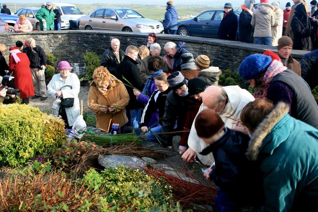 File:Making crosses at St Brigids Well.JPG