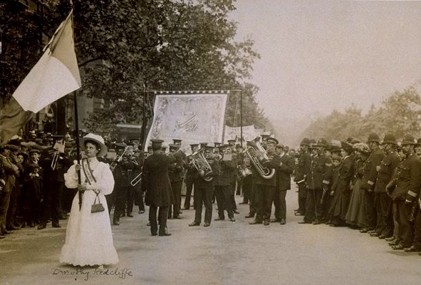 File:Dorothy Radcliffe holding aloft a purple, white and green flag.jpg