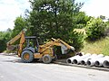 August 12thCase backhoe loader used for pipe transport to an excavated ditch