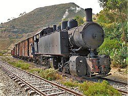 Preserved Ansaldo 442 steam locomotive pulling a freight train in Eritrea in 2006