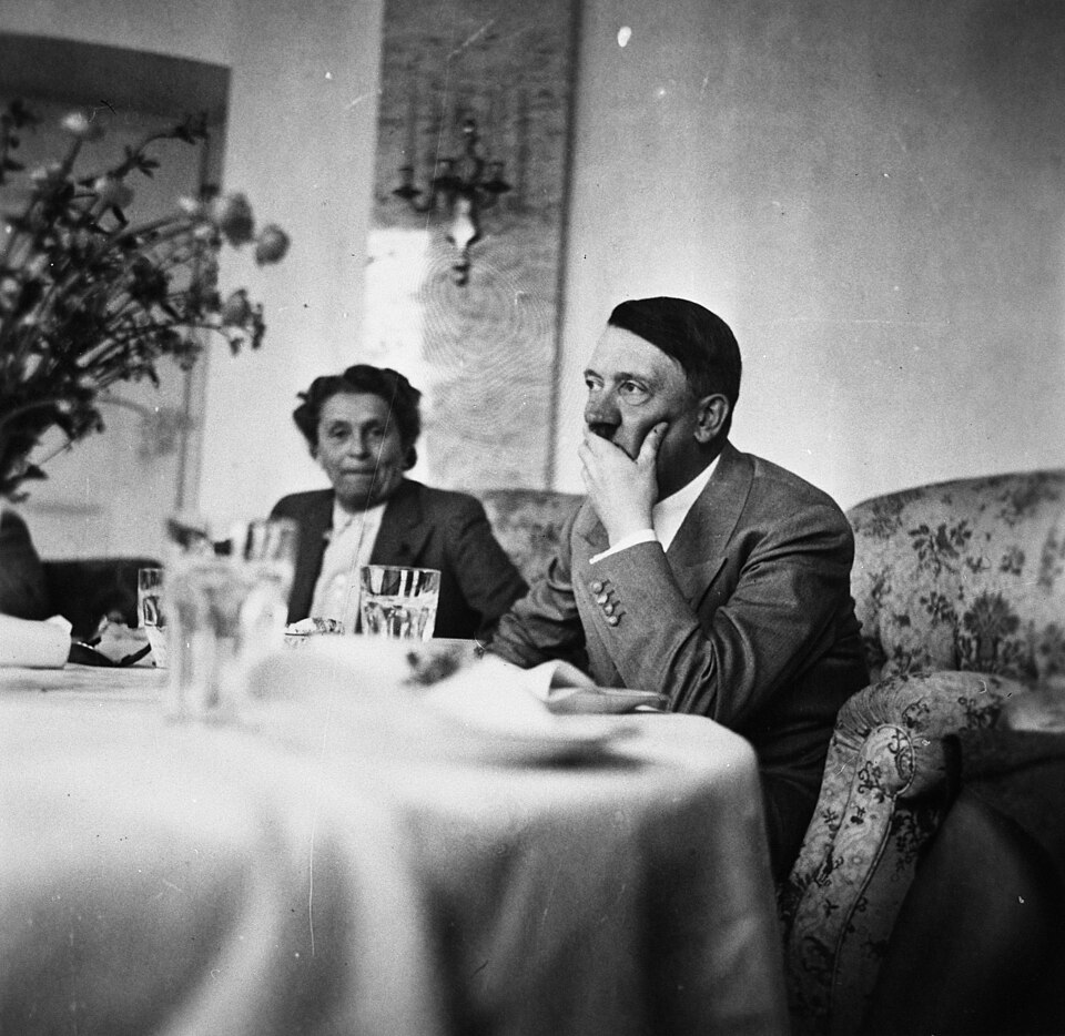 File:Hitler sitting at a table.jpg