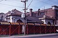 Metallic Roofing Company Offices surrounded by hoarding, prior to the demolition of the building.