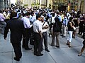 Workers evacuated from 40 Wall Street after Manhattan was struck by a 2011 earthquake felt across the east coast crowd along Wall Street. Photo by Alec Tabak