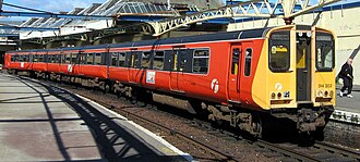 British Rail Class 314 train in orange and black Strathclyde Passenger Transport livery.