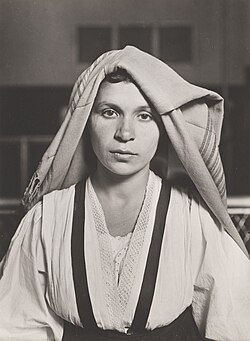 Lewis Wickes Hine, Woman with Folded Headdress, Ellis Island, NY, 1905