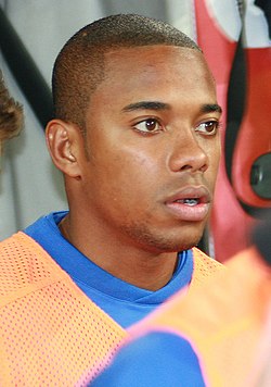 Head and shoulders of a young man with close cropped hair, facing right.