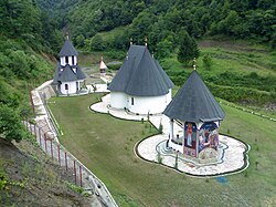 An aerial view of three buildings in Sase