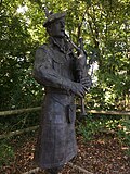 Bronze piper statue