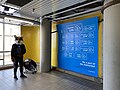 Photo area in Scarborough Centre Station with a blue backdrop reading "Farewell Line 3" in various languages, as well as social media handles for Meta-owned social websites and the hashtag #TakeTheTTC