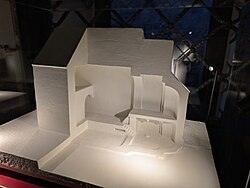 A model of a Romanesque church is seen.