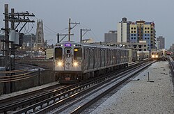 Purple Line Express train running along a former embankment track, viewed from Argyle station.
