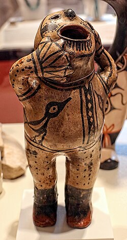 Humanoid ceramic figurine produced by the people of the Cochiti pueblo.