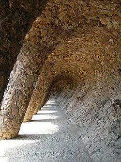 Vaulted retaining wall beneath the road