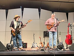 Musical duo Trout Fishing in America performing on a stage