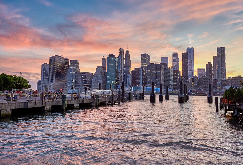 Sunset over Manhattan seen from the Brooklyn Bridge Park at the East River.