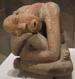 Terracotta seated figure from Mali; 13th century; earthenware; 29.9 cm (113⁄4 in) high; Metropolitan Museum of Art (New York City). The raised marks and indentations on the back of this hunched Djenné figure may represent disease or, more likely, sacrification patterns. The facial expression and pose could depict an individual in mouring or in pain