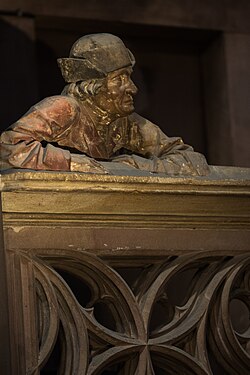 The man on the balustrade (south transept)