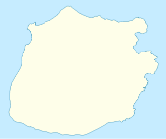 On the circular island of Saba, Ladder Bay is labeled on the western side, about halfway down the coast.