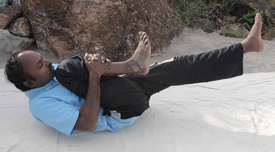 File:A style of pavanamuktasana (cropped).JPG