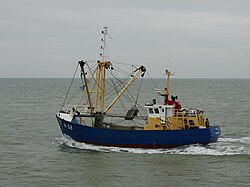 Fishing vessel equipped with a benthic dredge, leaving the port of Nieuwpoort