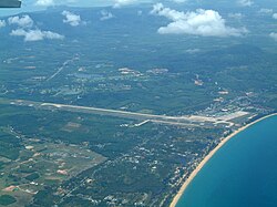 Aerial view of Phuket International Airport terminal building and runway
