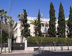 Neoclassical façade with columned portico.
