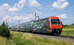 An SBB-CFF-FFS Re 450 double-decker push-pull train on S-Bahn Zürich line S16 near Henggart in 2009