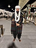A Baloch man in traditional Balochi men's clothes