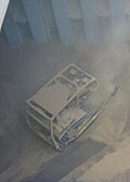 2. The bulldozer pushes cargo to the center of the hold.