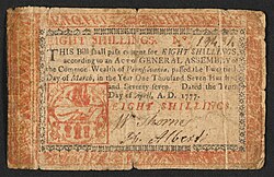 A 8s Pennsylvania note issued in 1777 with the inscription: ""THIS Bill shall pass current for EIGHT SHILLINGS, according to an Act of GENERAL ASSEMBLY of the Common Wealth of Pennsylvania, passed the Twentieth Day of March, in the Year One Thousand Seven Hundred and Seventy-seven. Dated the Tenth Day of April, A.D. 1777. EIGHT SHILLINGS."Vers ; Verso: "Eight Shillings. To Counterfeit is DEATH. PHILADELPHIA: Printed by JOHN DUNLAP. 1777."
