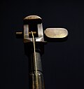 The single tuning peg of a tromba marina, turned by hand