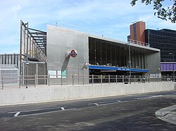 metal and glass building with open front on Wood Lane