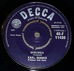 1961 Decca record of Denver's "Wimoweh", with the company logo, the artist's and producer's names, and other generic information about the track over a blue background.