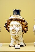 Terracotta vase in the shape of Dionysus' head, ca. 410 BC; on display in the Ancient Agora Museum in Athens, housed in the Stoa of Attalus