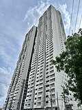 A skyscraper with a white painted exterior.