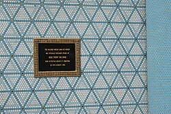 A plaque on a wall of a mosque