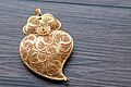 Image 2Typical Portuguese filigree heart shaped pendant, an iconic item in Portuguese fashion and design. (from Culture of Portugal)