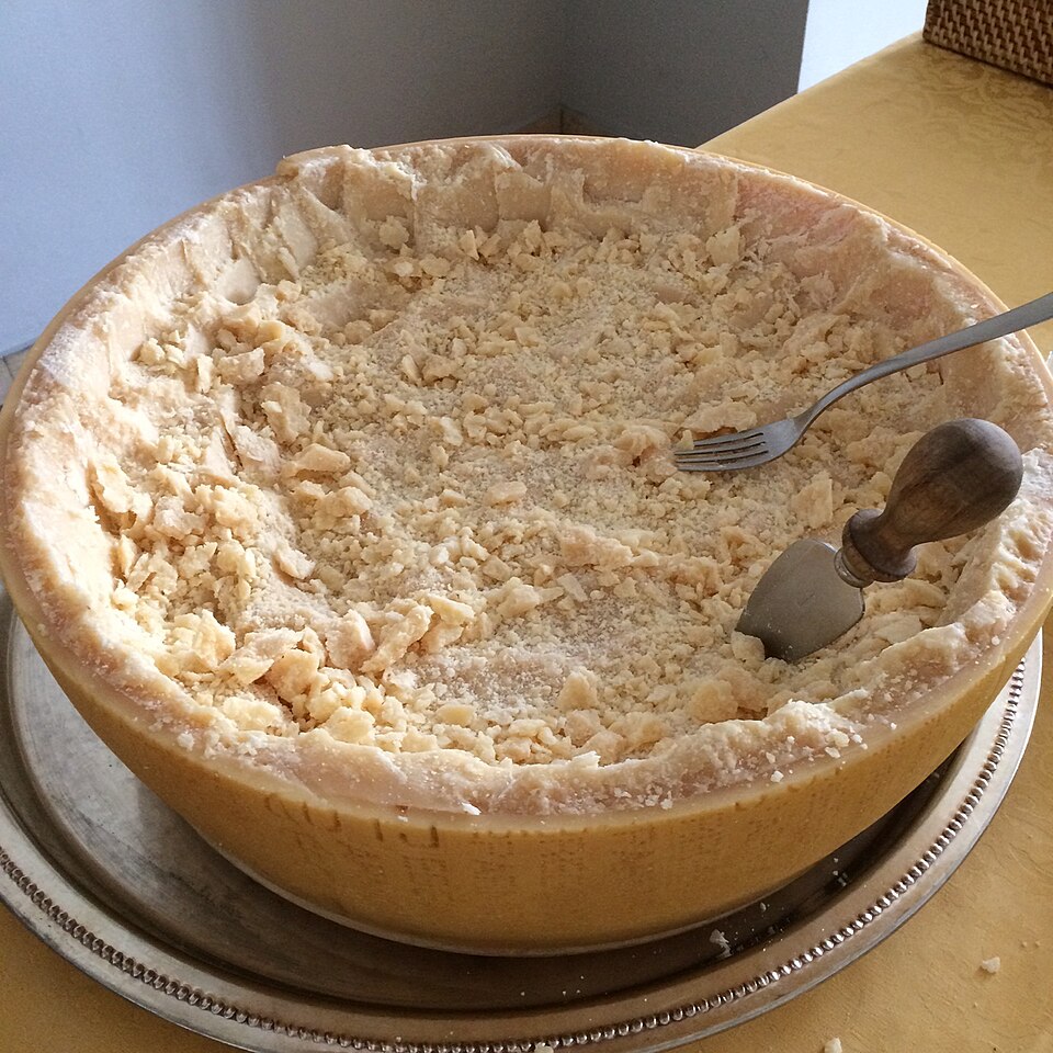 File:Half wheel parmesan cheese.jpg