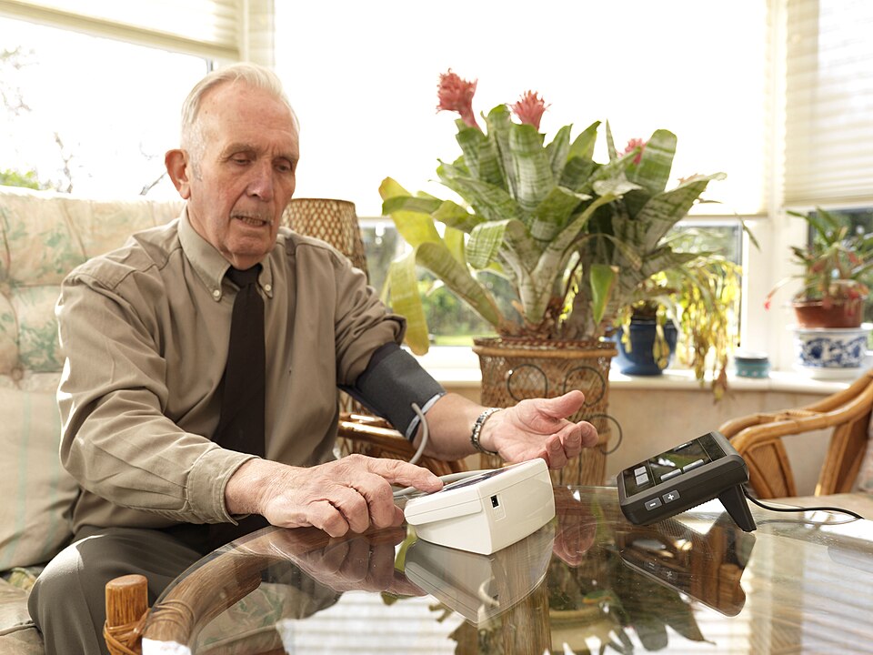 File:Man taking blood pressure with mymedic.jpg