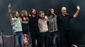 Foo Fighters after performing in June 2018. From left to right: Chris Shiflett, Taylor Hawkins, Dave Grohl, Nate Mendel, Rami Jaffee, and Pat Smear.