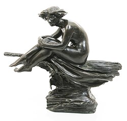 Bronze statuette of a witch atop a broomstick