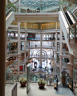 The Gallery at Harborplace's interior, as viewed from the third floor, on April 3, 2015, shows Starbucks on the second floor. Fifth floor seen on the top, with the windows covered in curtains.
