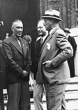 Three men in formal dress standing together