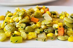 A serving of succotash, prepared with corn, lima beans, and bell peppers.
