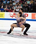 A pair team perform Besti squats (Emily Chan & Spencer Akira Howe)