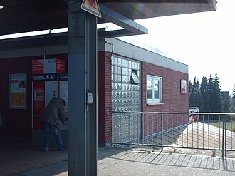 One-story brick building with metal platform roof