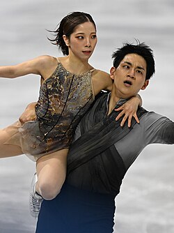 Riku Miura and Ryuichi Kihara perform on the ice.
